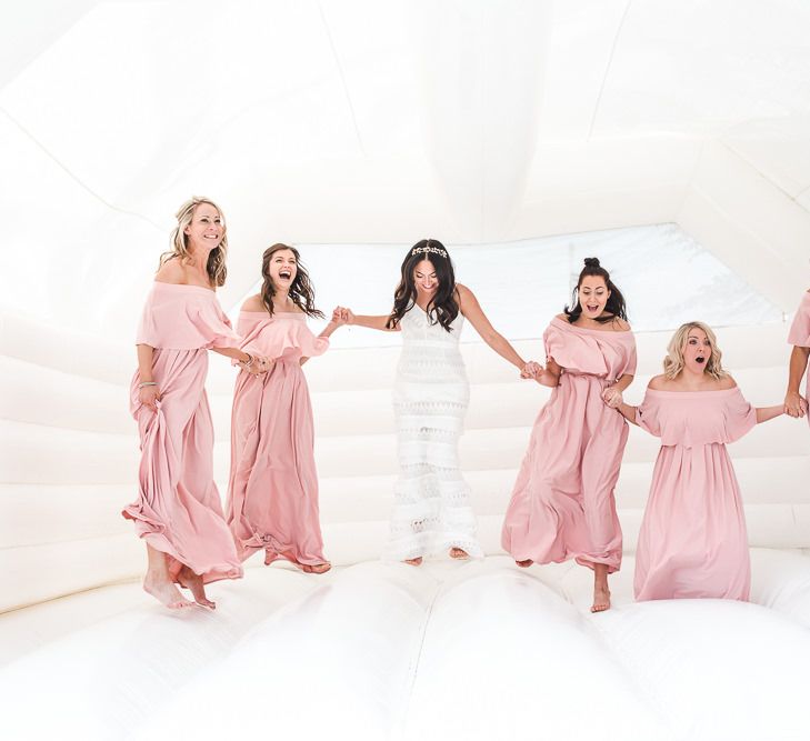 Bridesmaids in Dusky Pink ASOS Bardot Dresses | PapaKåta Sperry Tent at Chafford Park in Kent Countryside | Eve Dunlop Photography | Roost Film Co.