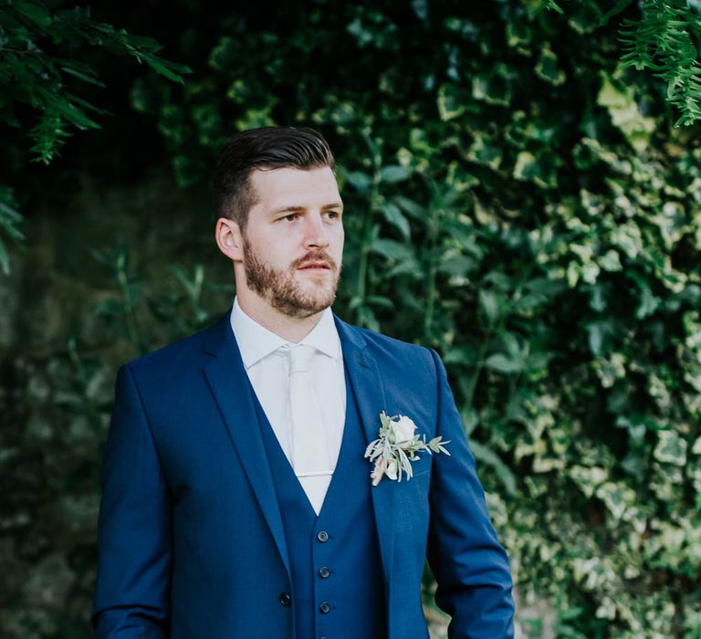 Groom in Navy Ted Baker Suit from Moss Bros | Cooling Castle Barn Wedding | Michelle Cordner Photography