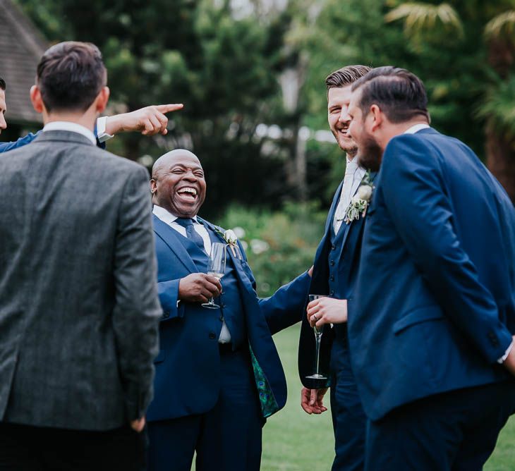 Groomsmen in Ted Baker Suits from Moss Bros | Cooling Castle Barn Wedding | Michelle Cordner Photography