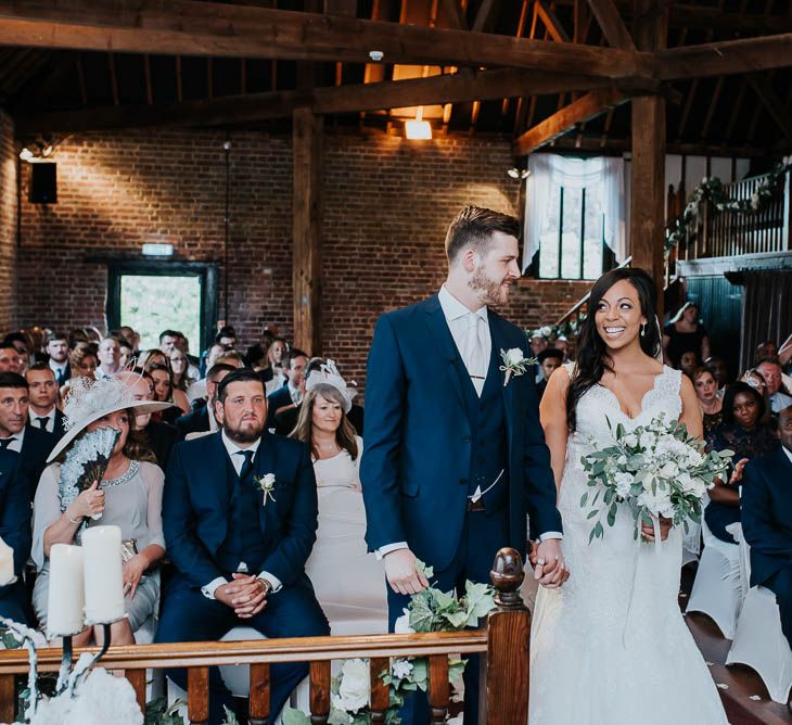 Wedding Ceremony | Bride in Mori Lee Gown | Groom in Ted Baker Suit from Moss Bros | Cooling Castle Barn Wedding | Michelle Cordner Photography