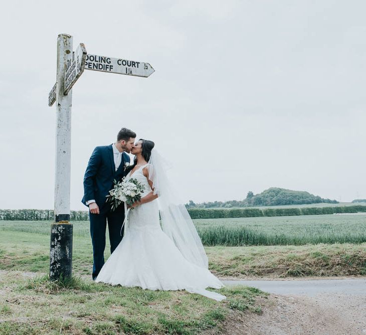 Bride in Mori Lee Gown | Groom in Ted Baker Suit from Moss Bros | Cooling Castle Barn Wedding | Michelle Cordner Photography