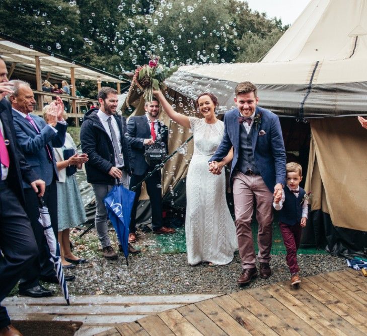 Bride in Lenora Watters Wtoo Lace Bridal Gown | Groom in Ted Baker Chinos & Reiss Waistcoat & Blazer | Bohemian Tipi Wedding Weekend at Fforest, Wales | Naomi Jane Photography