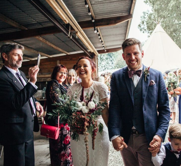 Bride in Lenora Watters Wtoo Lace Bridal Gown | Groom in Ted Baker Chinos & Reiss Waistcoat & Blazer | Bohemian Tipi Wedding Weekend at Fforest, Wales | Naomi Jane Photography