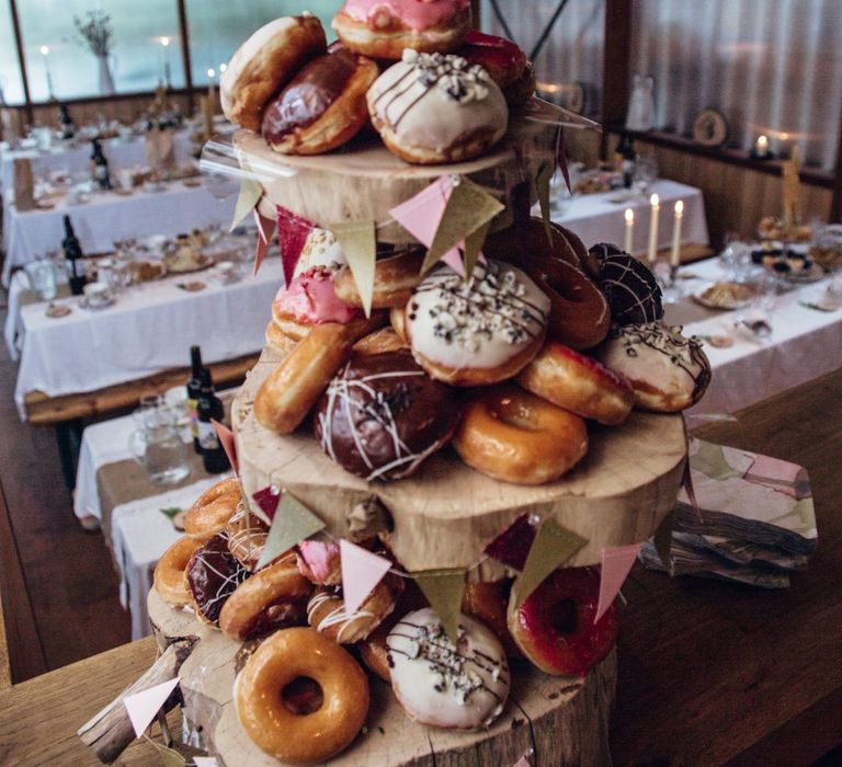 Krispy Kreme Doughnut Tower Wedding Cake | Bohemian Tipi Wedding Weekend at Fforest, Wales | Naomi Jane Photography