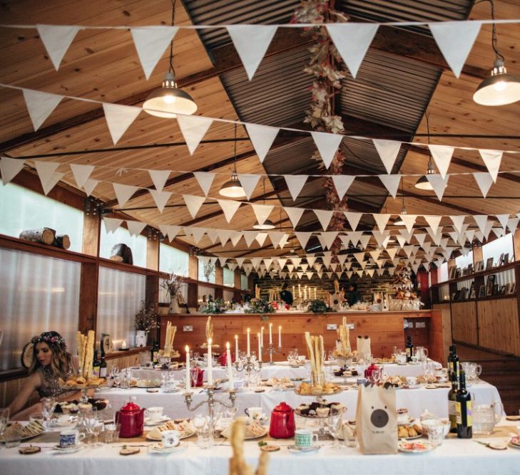 Reception with Bunting Decor | Bohemian Tipi Wedding Weekend at Fforest, Wales | Naomi Jane Photography