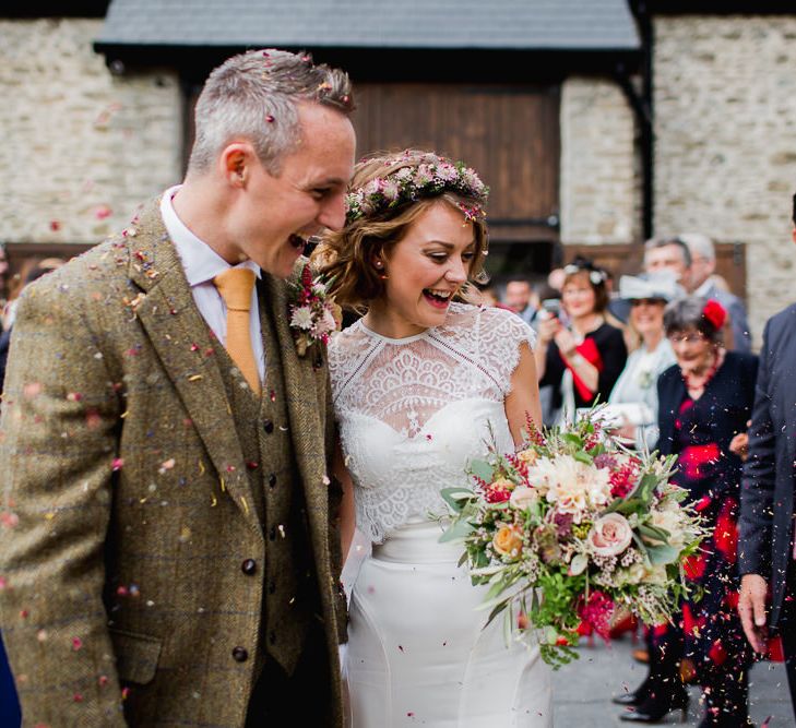 Confetti Exit | Bride in Flower Crown & Catherine Deane Separates | Groom in Harris Tweed | Country Wedding at Gorwell Farm, Dorset | Steph Newton Photography