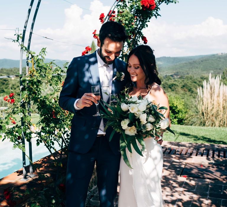 Bride in Sarah Seven Wedding Dress | Groom in Navy Paul Smith Suit | Outdoor Intimate Wedding at Casa Cornacchi in Tuscany, Italy | Dale Weeks Photography