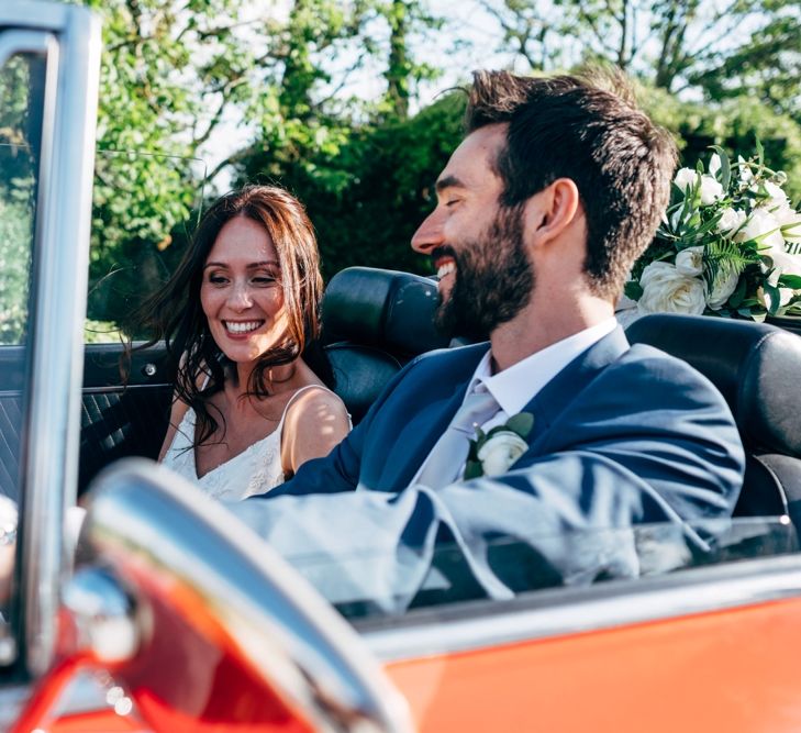 Red Sports Wedding Car | Bride in Sarah Seven Wedding Dress | Groom in Navy Paul Smith Suit | Outdoor Intimate Wedding at Casa Cornacchi in Tuscany, Italy | Dale Weeks Photography