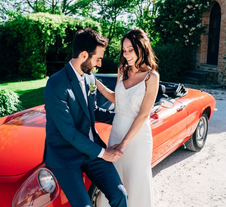 Red Sports Wedding Car | Bride in Sarah Seven Wedding Dress | Groom in Navy Paul Smith Suit | Outdoor Intimate Wedding at Casa Cornacchi in Tuscany, Italy | Dale Weeks Photography