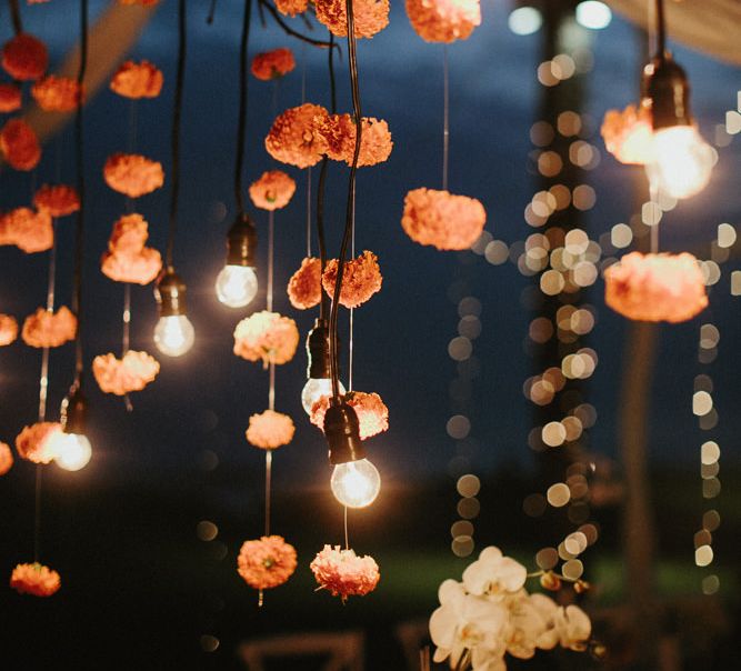 Incredible Outdoor Wedding Reception In Bali With Hanging Florals & Fairy Lights