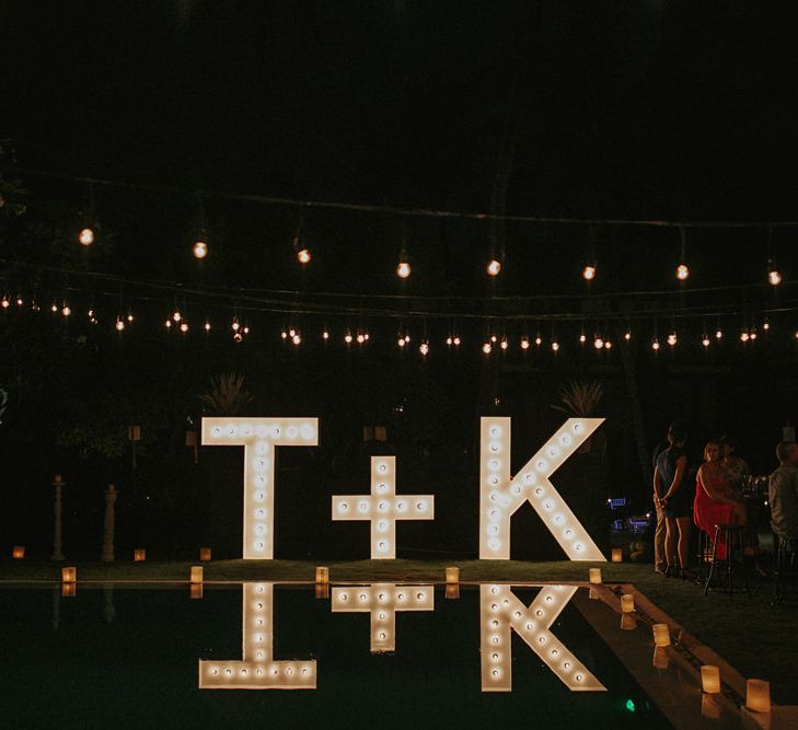 Incredible Outdoor Wedding Reception In Bali With Hanging Florals & Fairy Lights