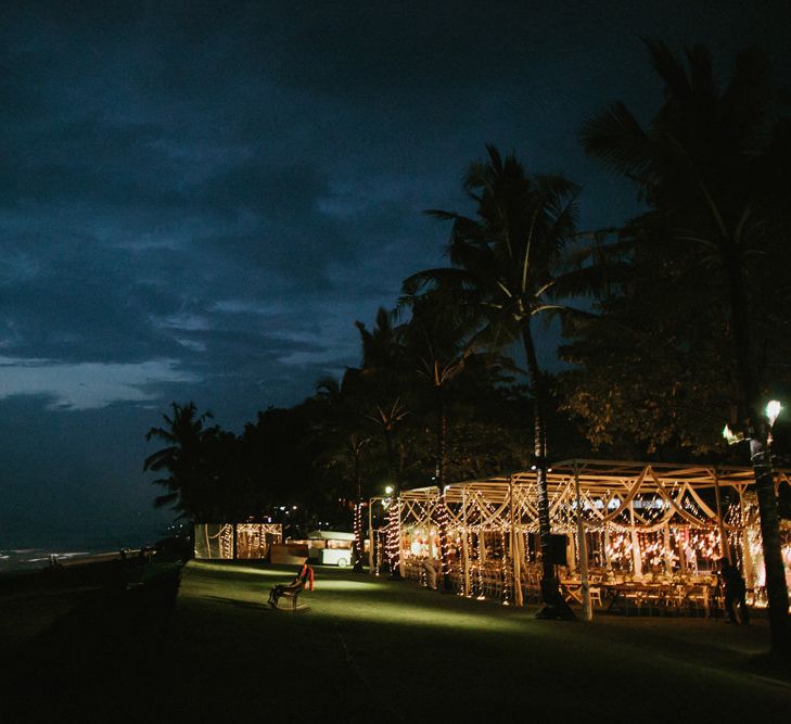 Incredible Outdoor Wedding Reception In Bali With Hanging Florals & Fairy Lights