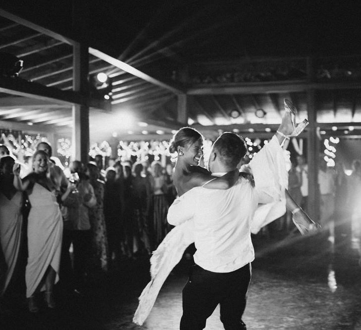 Incredible Outdoor Wedding Reception In Bali With Hanging Florals & Fairy Lights