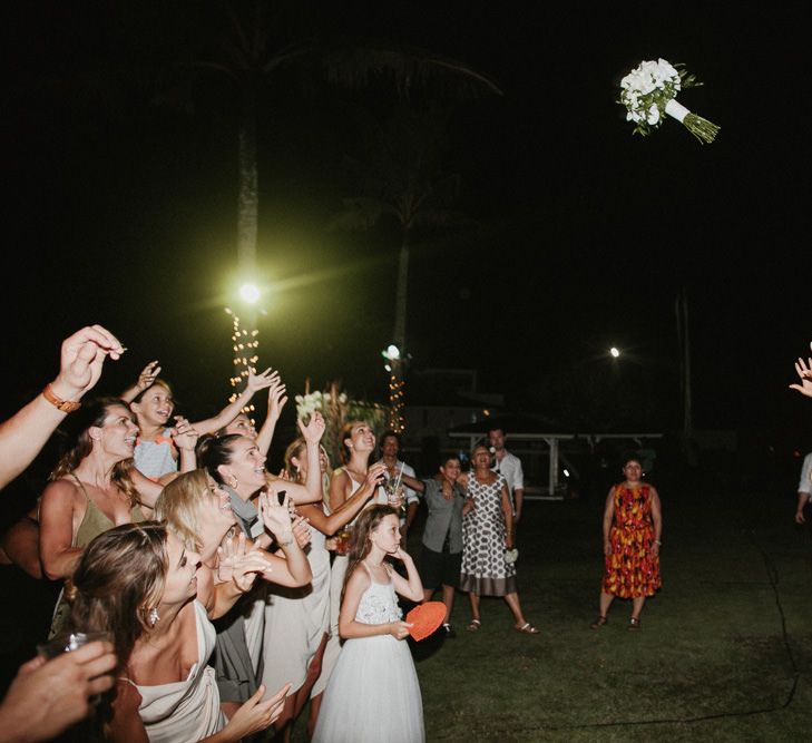 Incredible Outdoor Wedding Reception In Bali With Hanging Florals & Fairy Lights