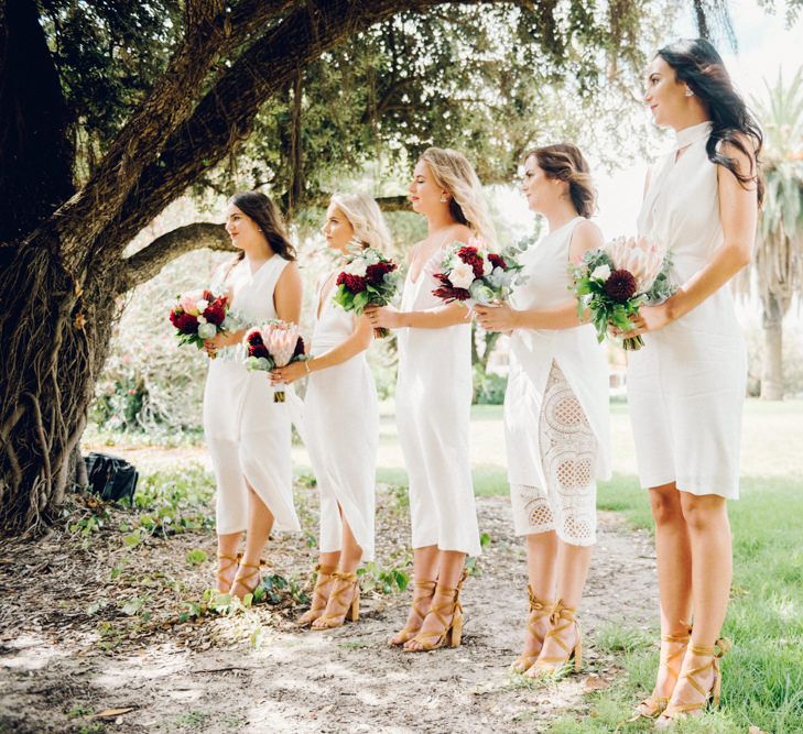 White Bridesmaid Dresses | Deep Red Protea Bouquets