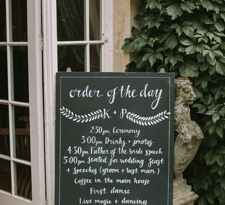 Order of the Day Chalkboard Sign | Blue & White Outdoor Summer Wedding at Maunsel House, Somerset | Maureen Du Preez Photography