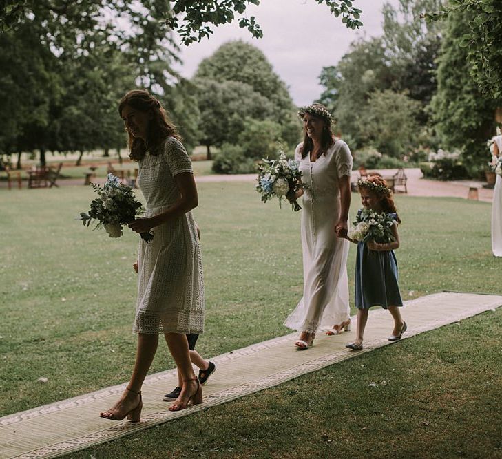 Bridesmaid Entrance in White Dresses | Blue & White Outdoor Summer Wedding at Maunsel House, Somerset | Maureen Du Preez Photography