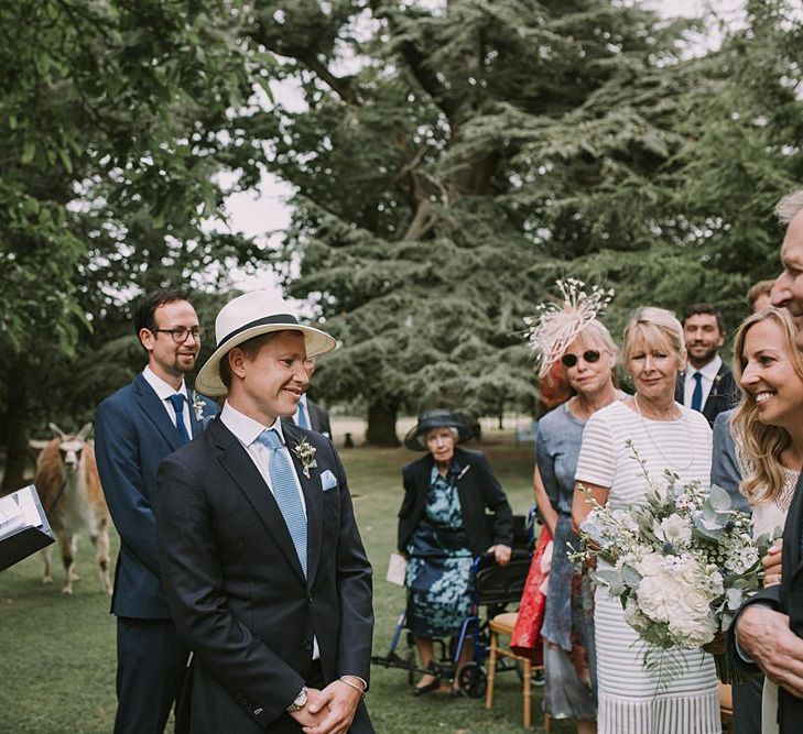 Groom in a Panama Hat at the Altar | Blue & White Outdoor Summer Wedding at Maunsel House, Somerset | Maureen Du Preez Photography