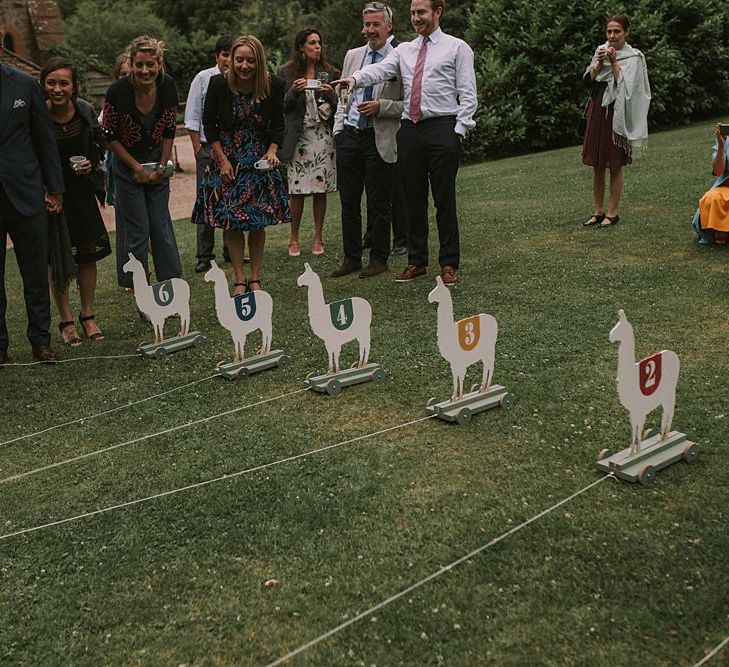 Wooden Llama Race | Blue & White Outdoor Summer Wedding at Maunsel House, Somerset | Maureen Du Preez Photography