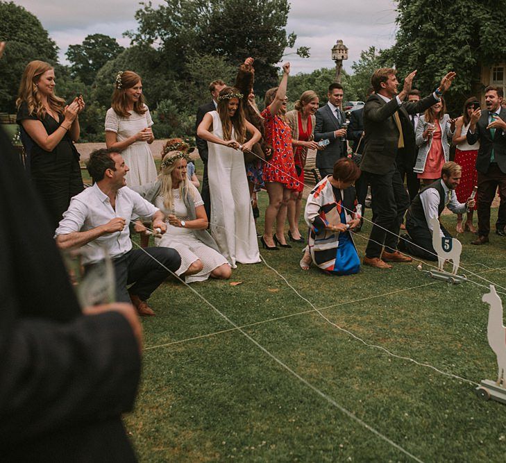 Wooden Llama Race | Blue & White Outdoor Summer Wedding at Maunsel House, Somerset | Maureen Du Preez Photography