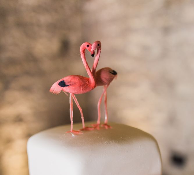 White Wedding Cake With Flamingo Cake Topper