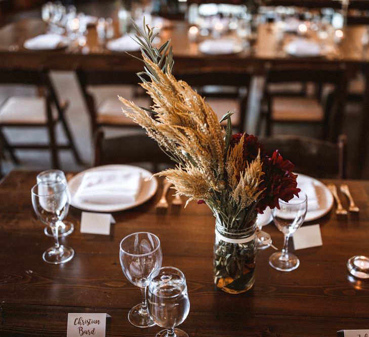 Wild Flowers in Jars Table Centrepiece | Outdoor Wedding at Claxton Farm in Weaverville, North Carolina | Benjamin Wheeler Photography