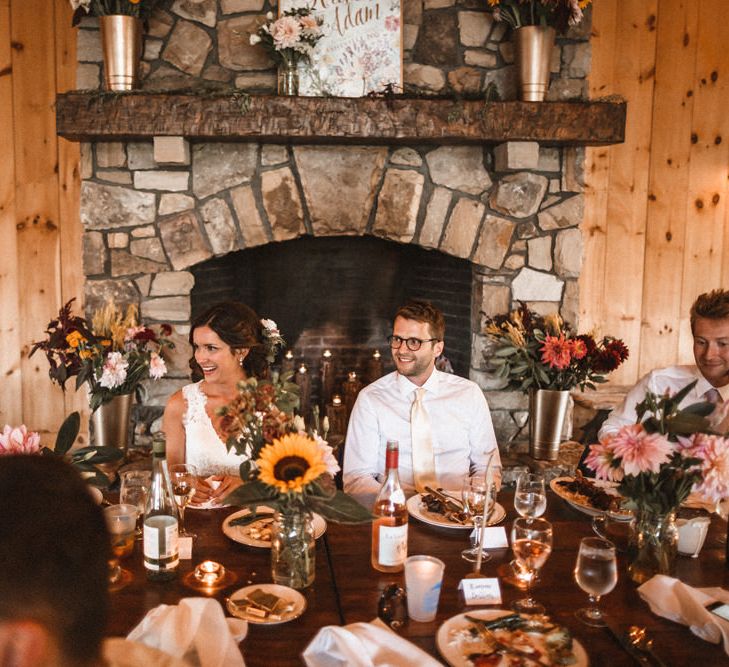 Top Table | Fireplace Backdrop | Wild Flower Decor | Outdoor Wedding at Claxton Farm in Weaverville, North Carolina | Benjamin Wheeler Photography