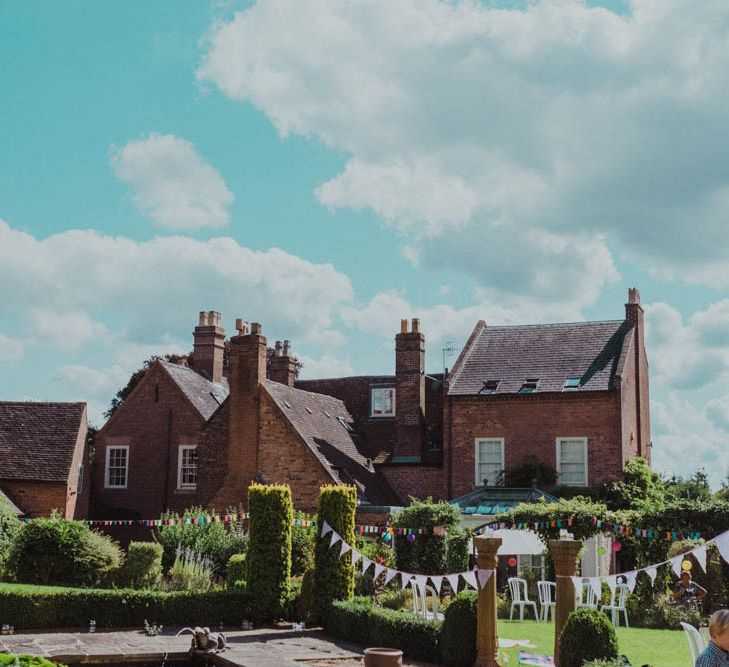 Intimate Garden Party Wedding at The Parsonage in The Cotswolds. Bride in Tatyana Merenyuk with Photography by Claudia Rose Carter.