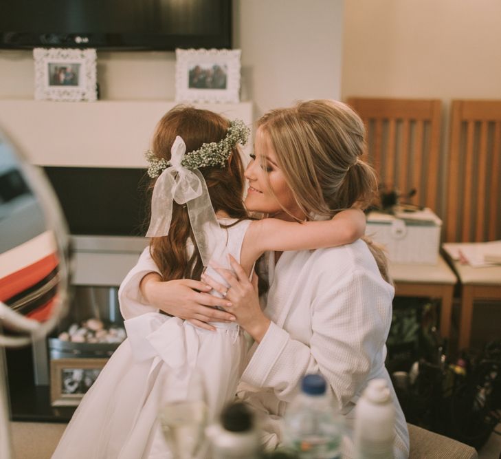 Hugs from one of the Flower girls | Owen House Wedding Barn | Cheshire | Image by Livi Edwards