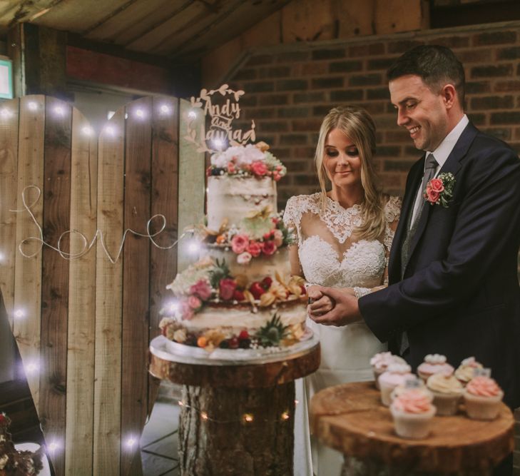 Cutting the Cake | Owen House Wedding Barn | Cheshire | Bespoke Bridalwear | Image by Livi Edwards