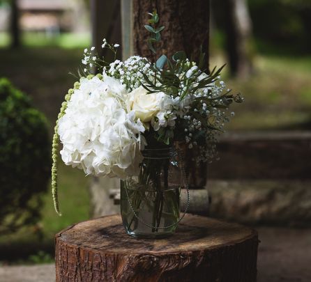 Rustic Tree Stump and Flowers in Vase Aisle Decor