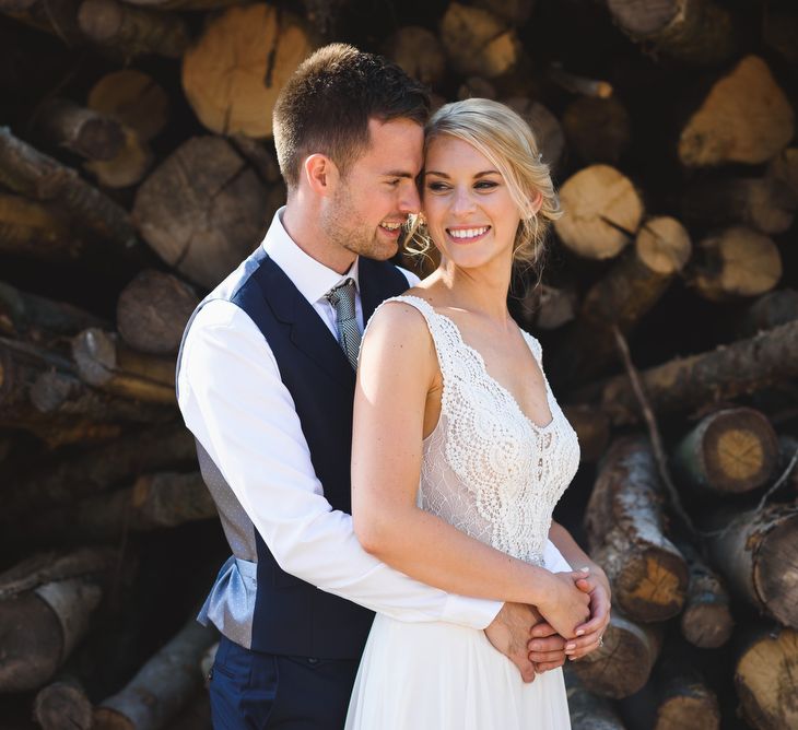 Bride in Flora 'Madlen' Wedding Dress from Blackburn Bridal Boutique and Groom in Ted Baker Suit