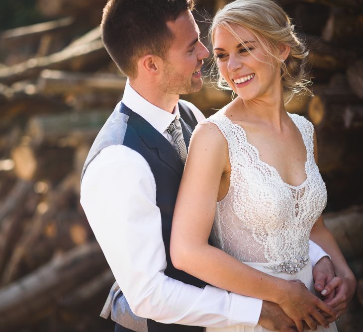 Bride in Flora 'Madlen' Wedding Dress from Blackburn Bridal Boutique and Groom in Ted Baker Suit