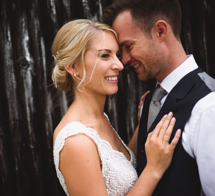 Bride in Flora 'Madlen' Wedding Dress from Blackburn Bridal Boutique and Groom in Ted Baker Suit