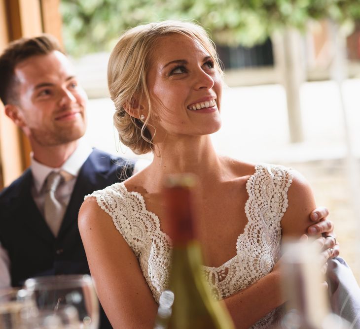 Bride in Flora 'Madlen' Wedding Dress from Blackburn Bridal Boutique and Groom in Ted Baker Suit