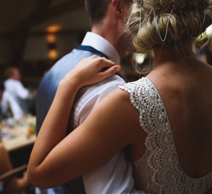 Bride in Flora 'Madlen' Wedding Dress from Blackburn Bridal Boutique and Groom in Ted Baker Suit