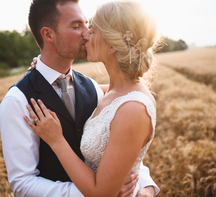 Bride in Flora 'Madlen' Wedding Dress from Blackburn Bridal Boutique and Groom in Ted Baker Suit