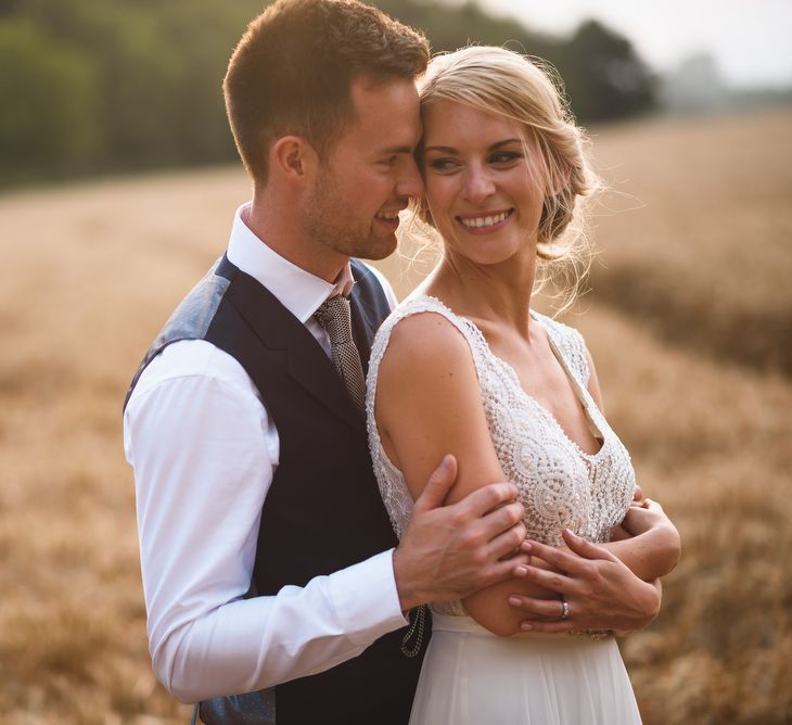 Bride in Flora 'Madlen' Wedding Dress from Blackburn Bridal Boutique and Groom in Ted Baker Suit