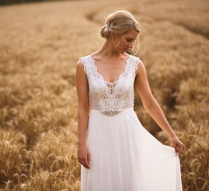 Bride in Flora 'Madlen' Wedding Dress from Blackburn Bridal Boutique and Groom in Ted Baker Suit