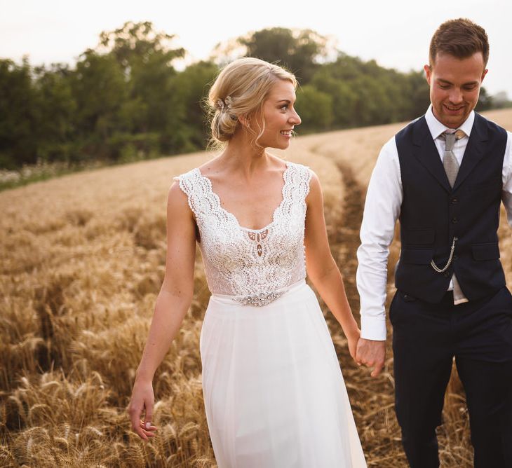 Bride in Flora 'Madlen' Wedding Dress from Blackburn Bridal Boutique and Groom in Ted Baker Suit