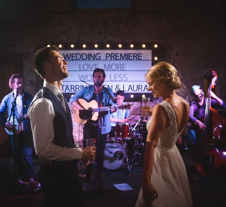 Bride in Flora 'Madlen' Wedding Dress from Blackburn Bridal Boutique and Groom in Ted Baker Suit