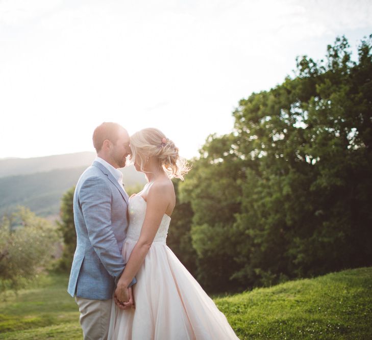 Sunsets | Bride in Lyn Ashworth Wedding Dress | Groom in Light Blue Jacket | Outdoor Wedding at Borgo Bastia Creti in Italy | Paolo Ceritano Photography