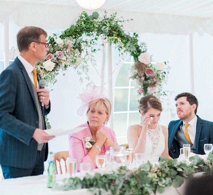 Floral Arch Top Table Backdrop | Lantern Filled Marquee Reception | Romantic Pastel Wedding at Prested Hall, Essex | Kathryn Hopkins Photography | Sugar Lens Productions