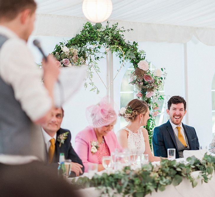 Floral Arch Top Table Backdrop | Lantern Filled Marquee Reception | Romantic Pastel Wedding at Prested Hall, Essex | Kathryn Hopkins Photography | Sugar Lens Productions