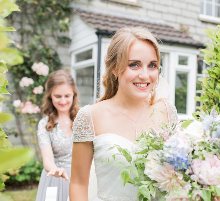 Almonry Barn Exclusive Hire Wedding Venue In Somerset With Pastel Flowers & Fairy Lights Images From Bowtie and Belle Photography With Bride In Wtoo By Watters