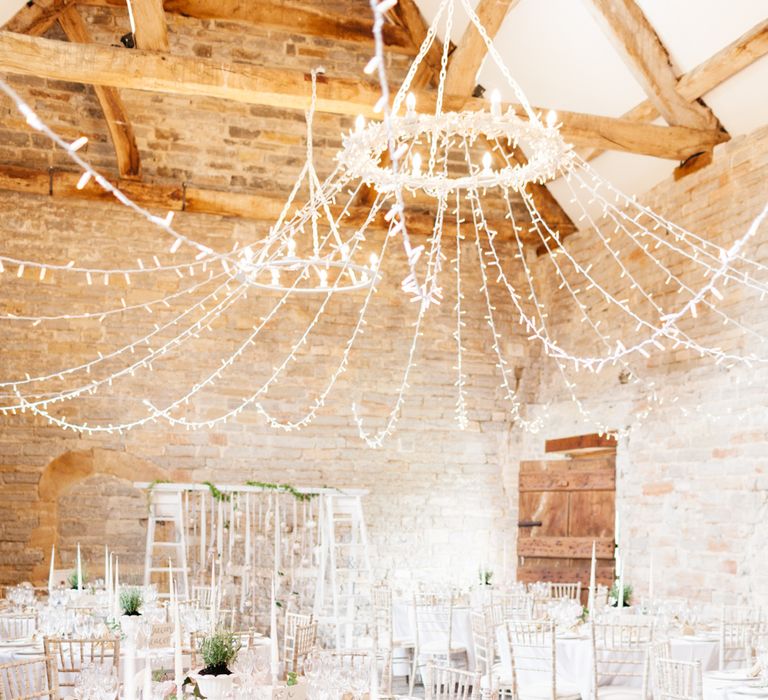 Almonry Barn Exclusive Hire Wedding Venue In Somerset With Pastel Flowers & Fairy Lights Images From Bowtie and Belle Photography With Bride In Wtoo By Watters