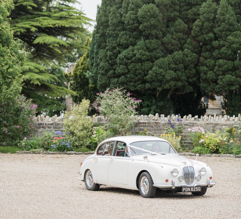 Almonry Barn Exclusive Hire Wedding Venue In Somerset With Pastel Flowers & Fairy Lights Images From Bowtie and Belle Photography With Bride In Wtoo By Watters