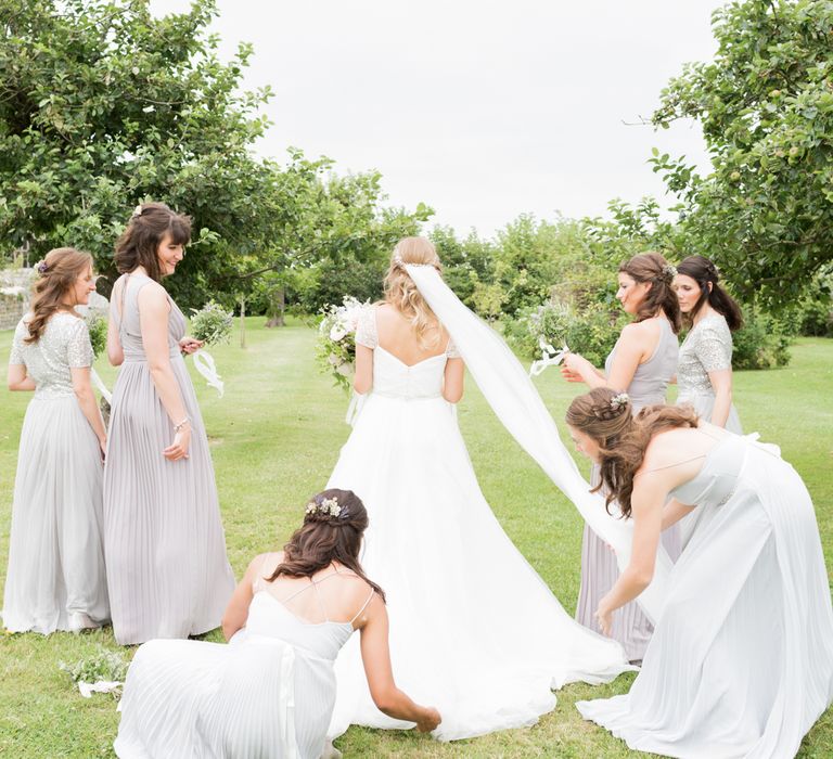 Almonry Barn Exclusive Hire Wedding Venue In Somerset With Pastel Flowers & Fairy Lights Images From Bowtie and Belle Photography With Bride In Wtoo By Watters