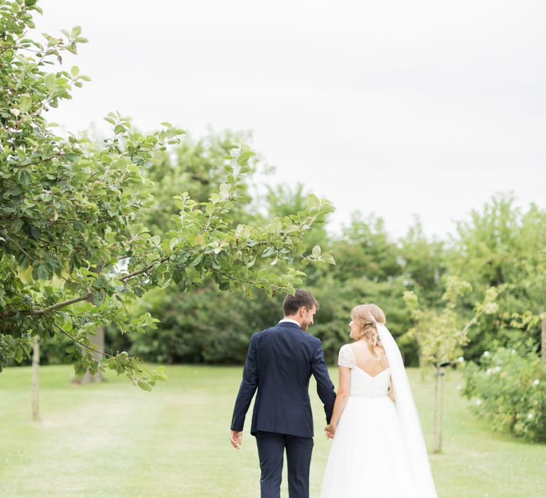 Almonry Barn Exclusive Hire Wedding Venue In Somerset With Pastel Flowers & Fairy Lights Images From Bowtie and Belle Photography With Bride In Wtoo By Watters