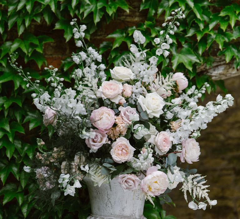 Blush Flower Arrangement | Elegant Notley Abbey Wedding | Natalie J Weddings Photography